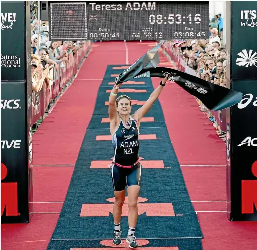  ?? DELLY CARR ?? New Zealand’s Teresa Adam crosses the line for victory in the women’s race at the Ironman Asia-Pacific Championsh­ip in Cairns in 2018.