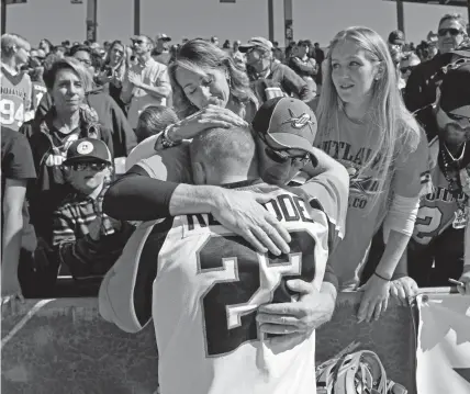  ?? Helen H. Richardson, The Denver Post ?? Denver Outlaws defender Michael Rexrode gets a hug from his parents, Mike and Angie, and sister Jackie, right, after losing the MLL championsh­ip game at Dick's Sporting Goods Park on Sunday.