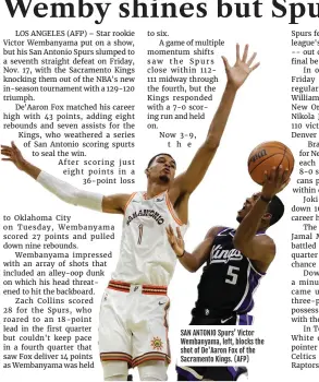  ?? ?? SAN ANTONIO Spurs’ Victor Wembanyama, left, blocks the shot of De'aaron Fox of the Sacramento Kings. (AFP)