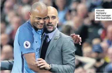  ??  ?? Vincent Kompany with manager Pep Guardiola