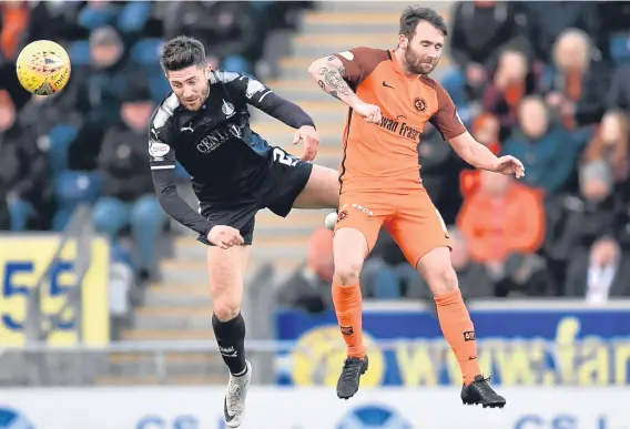  ??  ?? Dundee United’s James Keatings challenges Falkirk’s Lewis Kidd in their 6-1 loss to the Bairns on Saturday.