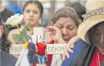  ?? TYLER PASCIAK LARIVIERE/SUN-TIMES ?? Members of the group Mothers and Families United for Justice rally Tuesday outside Chicago’s 10th District police station to demand police do more to solved unsolved murders.