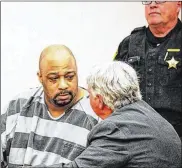  ?? J SWYGART/THE LIMA NEWS ?? Terrez Carter confers with his attorney, John Fisher, during his arraignmen­t Monday. If convicted on all 11 counts filed against him, Carter faces a prison sentence of up to 117 years.