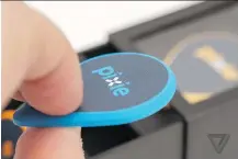  ??  ?? The Pixie, a Bluetooth-enabled fob, attaches to checked baggage and tracks it through an app.