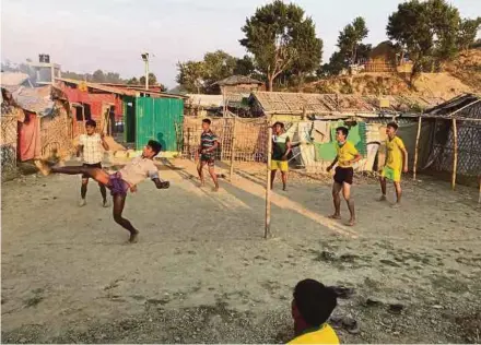  ?? REUTERS PIC ?? Rohingya refugees playing football in the Cox’s Bazar camp recently.