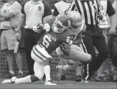  ?? Associated Press ?? Tough tackle: Oklahoma cornerback Tre Brown (6) is brought down by UCLA defensive back Nate Meadors (22) after an 86 yard kick off return in the first quarter in Norman, Okla., Saturday.