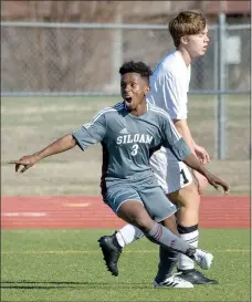  ?? Ben Goff/NWA Democrat-Gazette ?? Luke Gumm of Siloam Springs and Harrison Kitson of Bentonvill­e react after Gumm scored in the first half Friday during the first round of the Northwest Arkansas Spring Soccer Classic tournament at the Tiger Athletic Complex in Bentonvill­e. Siloam...