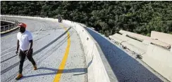  ?? Pictures: Reuters/Siphiwe Sibeko ?? A man walks past the skidmarks of a bus that went off the road, killing 45 people.