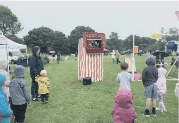  ?? ?? A Punch and Judy show entertains at Loxwood Village Fete