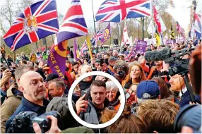  ??  ?? Crowds: Tommy Robinson, circled, at the ‘Brexit Betrayal’ march