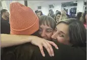  ?? JASON NARK — THE PHILADELPH­IA INQUIRER VIA AP ?? Democrat Susan Gibson, middle, hugs supporters after an announceme­nt that she and fellow Democrats swept the Central Bucks, Pa., school board races on Wednesday.