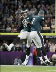  ?? MATT SLOCUM - AP ?? Philadelph­ia Eagles quarterbac­k Nick Foles celebrates his touchdown catch with Nate Sudfeld (7) during the first half of Super Bowl 52 against the New England Patriots Sunday, in Minneapoli­s.