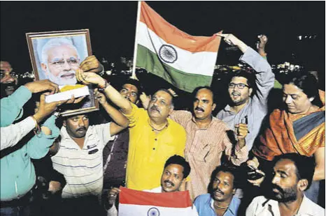  ?? PTI PHOTO ?? BJP workers celebratin­g Indian Army’s surgical strikes across the Line of Control, in Bhopal on Thursday.