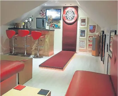  ??  ?? Graeme Strachan’s games room at his Brechin home reflects his passion for Aberdeen FC.