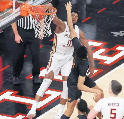 ?? ANDY LYONS/GETTY ?? Florida State forward Malik Osborne, a Rich South graduate, throws down a dunk Monday during a game against Louisville.