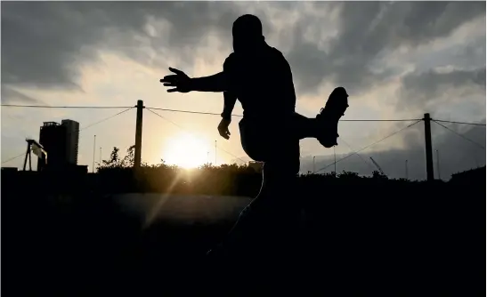  ?? GETTY IMAGES ?? Richie Mo’unga, here kicking during an All Blacks training session in Tokyo this week, always cut a relaxed figure, whether playing for his first XV or the All Blacks.