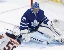  ?? AP ?? KICK SAVE AND A BEAUTY: Frederik Anderson makes one of his 30 saves in the Maple Leafs’ 4-2 win over the Oilers last night in Toronto.