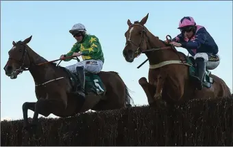  ??  ?? Le Breuil and Jamie Codd jump the last ahead of Discorama and Barry O’Neill at Cheltenham in 2019.