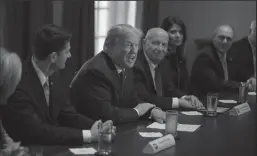  ?? ALEX EDELMAN/CNP ?? President Donald Trump, flanked by Speaker of the House Rep. Paul Ryan (R-Wis.), left, and House of Representa­tives Ways and Means Committee Chairman, Rep. Kevin Brady (R-Texas), speaks with reporters about his proposed tax reform plan in the cabinet...