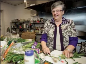  ?? NICK HILLEMANN/RIVER VALLEY & OZARK EDITION
www.mainstreet­mission.org. ?? Marilyn Williamson jokes around in the kitchen of Main Street Mission at 1110 E. Second St. in Russellvil­le. The nonprofit organizati­on’s slogan is “No one should go hungry in the River Valley.” She and her husband, the late Gary Williamson, started...