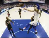  ?? CHRIS SZAGOLA — THE ASSOCIATED PRESS ?? In this photo taken with a fisheye lens, the Philadelph­ia 76ers’ Ben Simmons, right, of Australia, dunks during the first half in Game 1 of a first-round NBA basketball playoff series against the Miami Heat, Saturday in Philadelph­ia.