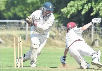  ?? ?? Stamford Town wicket-keeper Andrew Hulme in action.