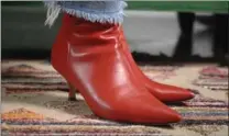  ??  ?? A great pair of ankle boots is one of Costanzo’s top five wardrobe essentials, like these red kitten heel ankle boots from Winners.