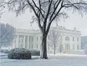  ?? ANDREW HARNIK/AP ?? More than half the flights at Washington’s three major airports were either delayed or canceled Monday morning, Flightawar­e said.