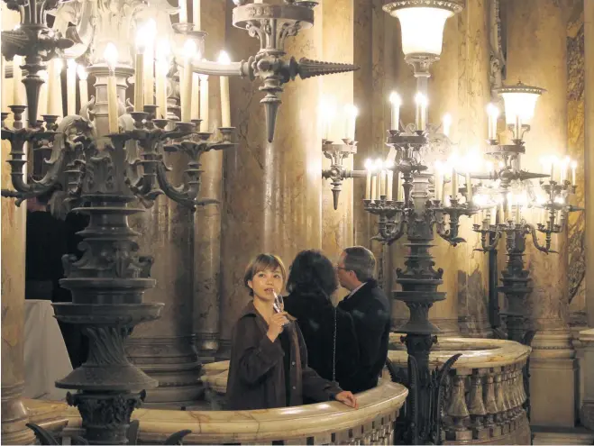  ??  ?? IN THE WINGS: A guest sips Champagne on a balcony at the Opéra Garnier at the special launch event for the Saison Culturelle