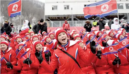  ?? AFP ?? North Korean cheerleade­rs sing at the Jeongseon Alpine Centre during the Pyeongchan­g 2018 Winter Olympic Games yesterday.