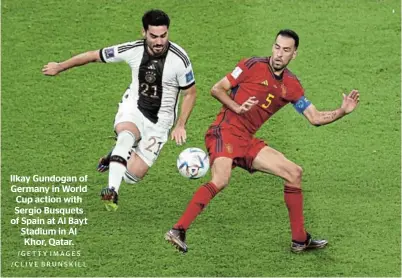  ?? /GETTY IMAGES /CLIVE BRUNSKILL ?? Ilkay Gundogan of Germany in World Cup action with Sergio Busquets of Spain at Al Bayt Stadium in Al Khor, Qatar.