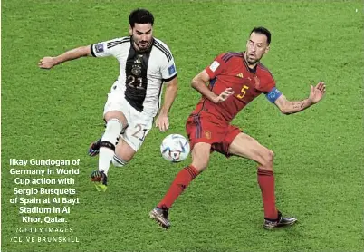  ?? /GETTY IMAGES /CLIVE BRUNSKILL ?? Ilkay Gundogan of Germany in World Cup action with Sergio Busquets of Spain at Al Bayt Stadium in Al Khor, Qatar.