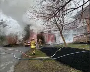  ??  ?? Crew battled a garage fire within feet of a home Wednesday morning at Limekiln and Wegman roads in Exeter Township.
