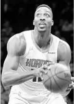  ?? ABBIE PARR/GETTY IMAGES ?? Former Magic star Dwight Howard turned back the clock earlier this week with a 32-point, 30-rebound performanc­e in the Hornets’ win over the Nets.