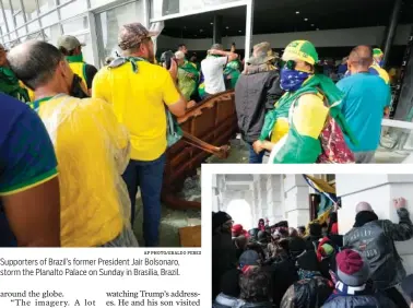  ?? AP PHOTO/ERALDO PERES AP PHOTO/JOSE LUIS MAGANA ?? Supporters of Brazil’s former President Jair Bolsonaro, storm the Planalto Palace on Sunday in Brasilia, Brazil.
Insurrecti­onists loyal to President Donald Trump try to open a door of the U.S. Capitol in 2021 as they riot in Washington.