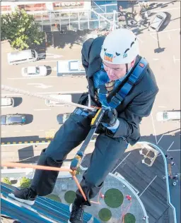 ??  ?? As a former chief executive of the well-known children’s charity Make-A-Wish, Coromandel MP Scott Simpson abseiled down a 17-storey building on Auckland’s Queen St to raise money for their wish granting programme. He said, “I’d been told the first metre would be the scariest and it was!”