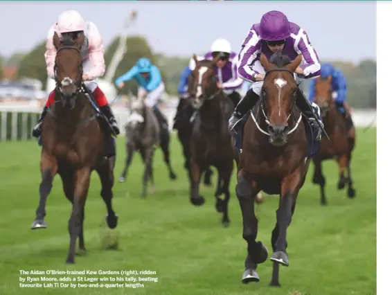  ??  ?? The Aidan O’Brien-trained Kew Gardens (right), ridden by Ryan Moore, adds a St Leger win to his tally, beating favourite Lah Ti Dar by two-and-a-quarter lengths