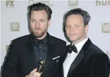  ?? WILLY SANJUAN/INVISION/THE ASSOCIATED PRESS ?? Ewan McGregor, left, with Fargo creator Noah Hawley, picked up a Golden Globe Sunday.