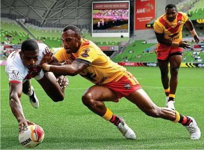  ?? GETTY IMAGES ?? Touching distance: Jermaine McGillvary reaches out to score a try in England’s victory