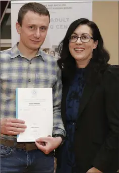  ??  ?? Dorin Gabatiuc recieves his certificat­e from KWETB director of further education and training Caitriona Murphy.