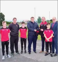  ??  ?? Conor Conway of Mulhern Leonard Accountant­s presenting John Clifford St. Marys with socks and togs for the St. Marys Under 14 Panel.