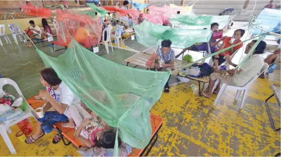  ?? Photo: EPA ?? Patients suffering from dengue fever in a makeshift hospital in Maasin in the Philippine province of Iloilo.