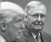  ?? AP PHOTO ?? In this September file photo, Senate Majority Leader Mitch McConnell, R-Ky., right, listens as President Donald Trump speaks during a meeting with Congressio­nal leaders and administra­tion officials in the Roosevelt Room of the White House in Washington.