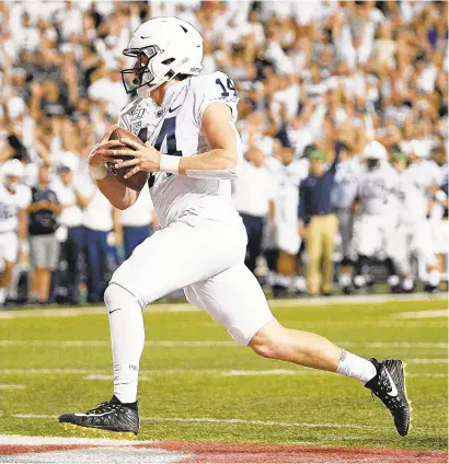  ?? NICK WASS/AP ?? Penn State quarterbac­k Sean Clifford threw for 398 yards and three touchdowns, ran for a score and carried No. 12 Penn State to yet another lopsided victory over Maryland.