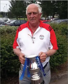  ??  ?? Arklow Town FC President John Kavanagh with the Fenlon Cup.