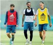  ?? — AFP ?? Argentina’s Lionel Messi (from left), Augusto Fernandez and Angel Di Maria during a training session ahead of their World Cup qualifier against Uruguay.