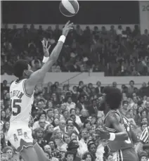  ?? STAFF FILE ?? The Virginia Squires’ George Gervin puts up a shot during the 1974 ABA All-Star Game at Scope.