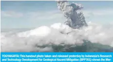  ?? — AFP ?? YOGYAKARTA: This handout photo taken and released yesterday by Indonesia’s Research and Technology Developmen­t for Geological Hazard Mitigation (BPPTKG) shows the Merapi Mount volcano spewing thick smoke into the air as seen from Yogyakarta.