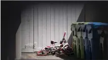  ?? DAVID CRANE — STAFF PHOTOGRAPH­ER ?? Three bicycles remain staked near the driveway of the home in the 22500block of Victory Boulevard in West Hills on Wednesday.