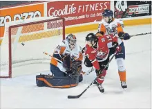  ?? JULIE JOCSAK
ST. CATHARINES STANDARD ?? Goalie Garrett Forrest of the Flint Firebirds defends the net against Ian Martin of the Niagara IceDogs in OHL action at the Meridian Centre in St. Catharines on Thursday, March 8, 2018.